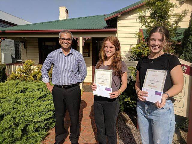 CLEVER MINDS: Krishnankuttynair Rajamma Rajesh congratulations the recipients of his prize Judith Browne and Riley Murdoch. 