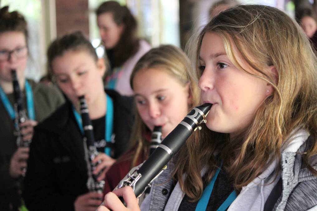 SHOWTIME: Students at the ninth annual Sapphire Coast Learning Community Public School Music Camp rehearse for their final concert last Thursday. 