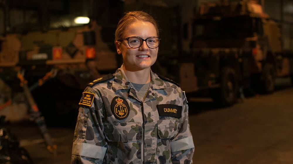 Leading Seaman Combat Systems Operator Tina Dummett in the heavy vehicle deck onboard HMAS Adelaide during Operation Bushfire Assist 19-20. Picture: ABIS Thomas Sawtell