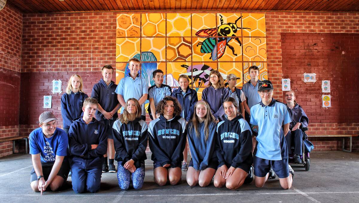 STUNNING MURAL: Bega High students love the new bee-inspired mural that was created as part of the apiary project at the school.