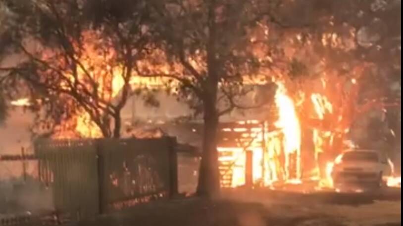 A screengrab of video by Mick O'Reilly as Bemboka residents fight to save homes during the recent Werri Berri fire. 