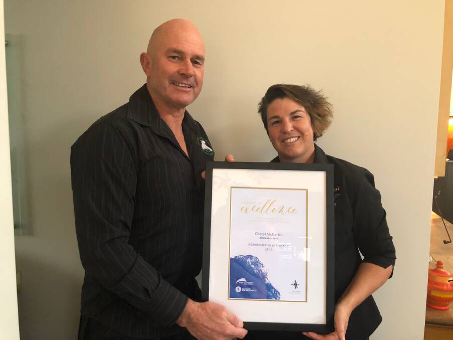 COMMITTED WORKER: Cheryl McCarthy is presented the NSW Surf Life Saving Awards of Excellence's Administrator of the Year Award by Surf Life Saving Far South Coast branch president Tony Rettke. Picture: Supplied