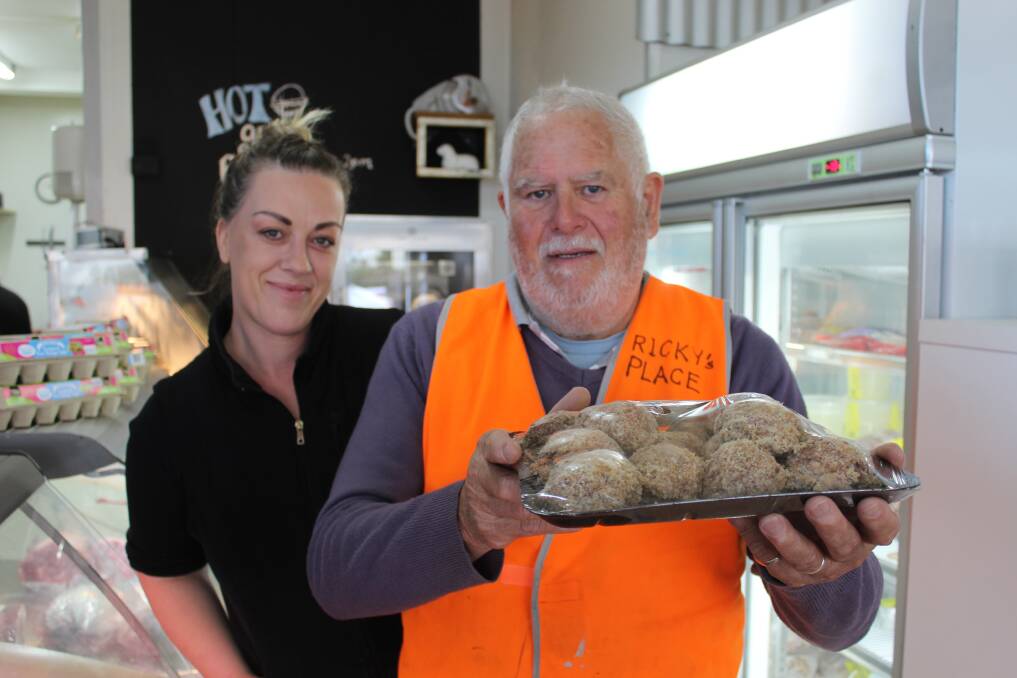 HELPING THOSE IN NEED: Mimosa Meat's Emma Orr hands Peter Burgess some supplies for Ricky's Place on Monday. 