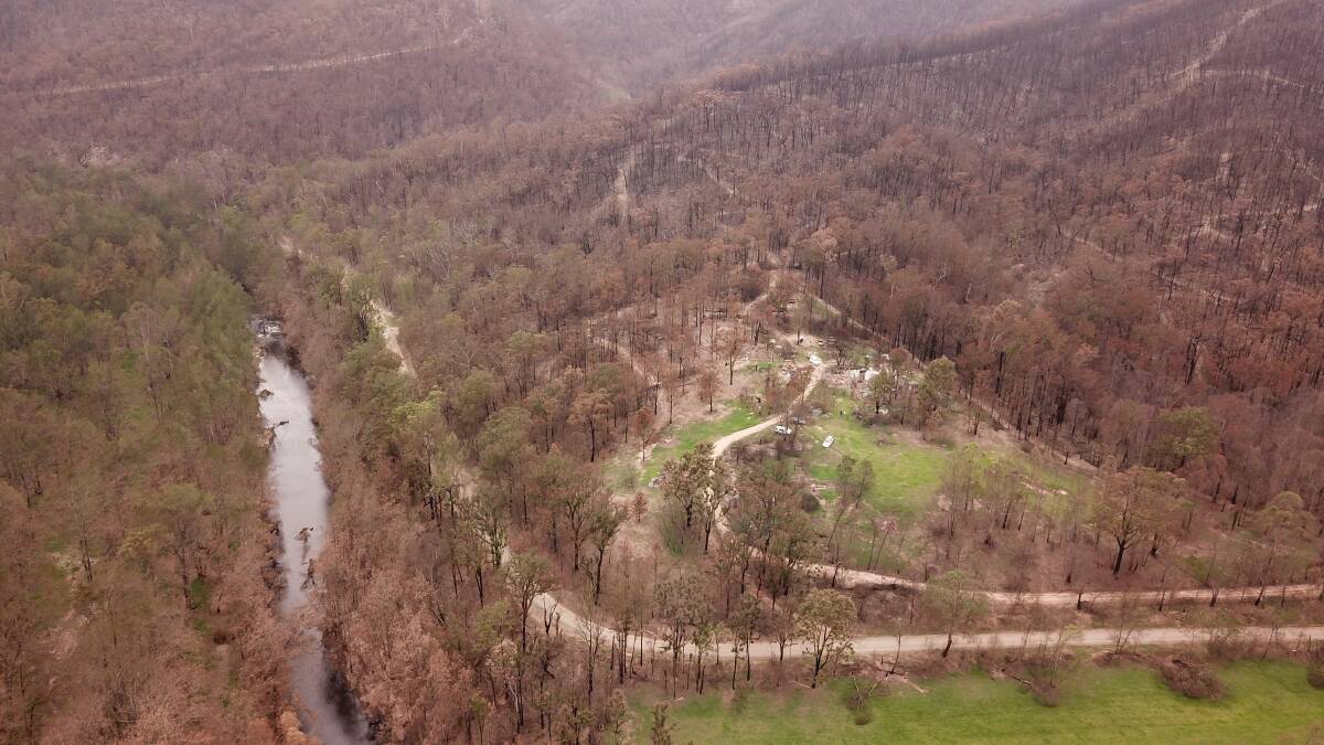 A property in the Deua Valley that was destroyed in last summer's fires. The Deua River is pictured at left. PICTURE: Stack Space
