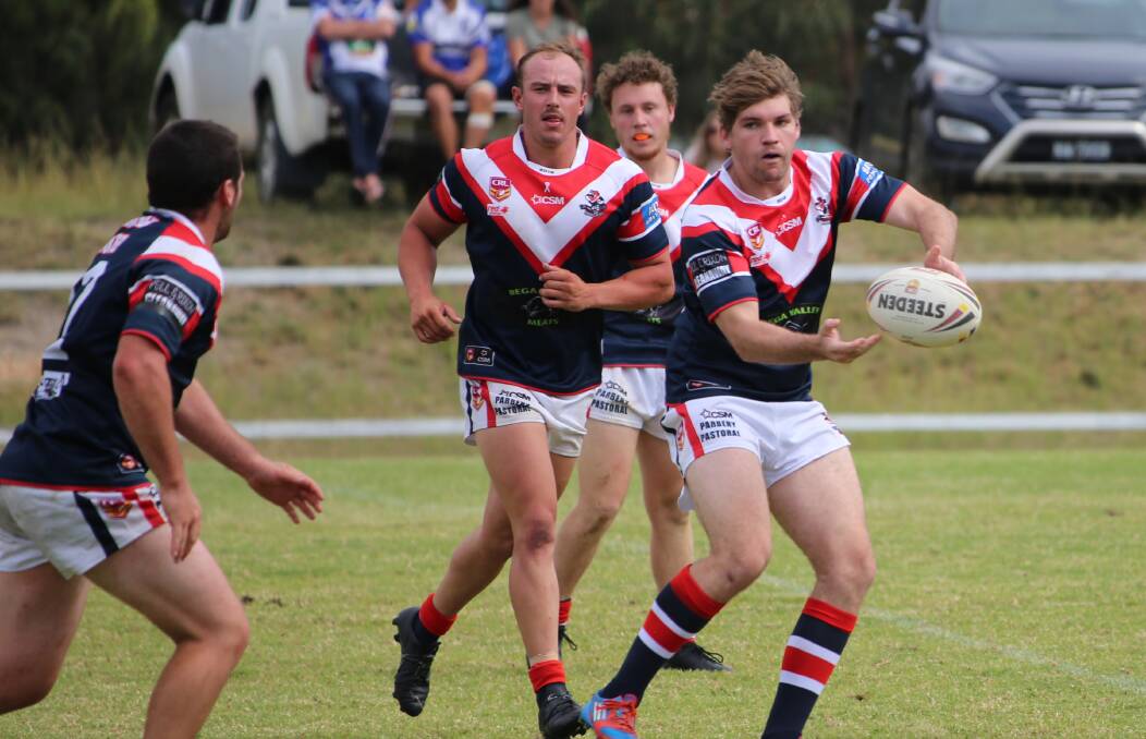 PLAYING STRONG: Scott Fuller sends a pass down the line during a match for the Bega Roosters last year. 
