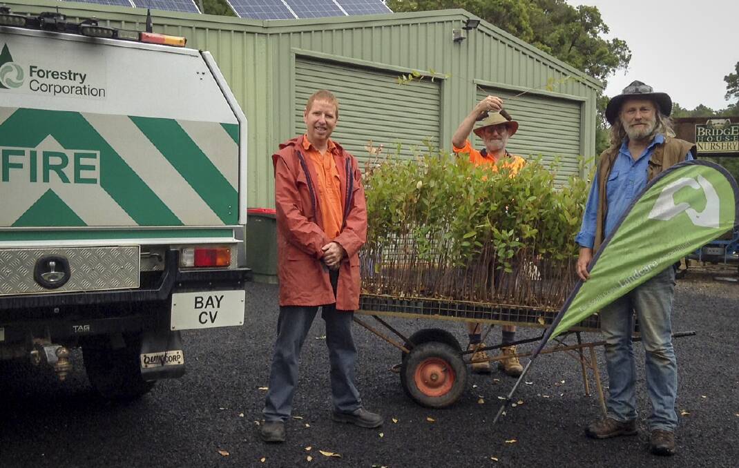 Forestry Corporation's Julian Armstrong with Bridge House Nursery owner Don Firth and Landcare coordinator Chris Post
