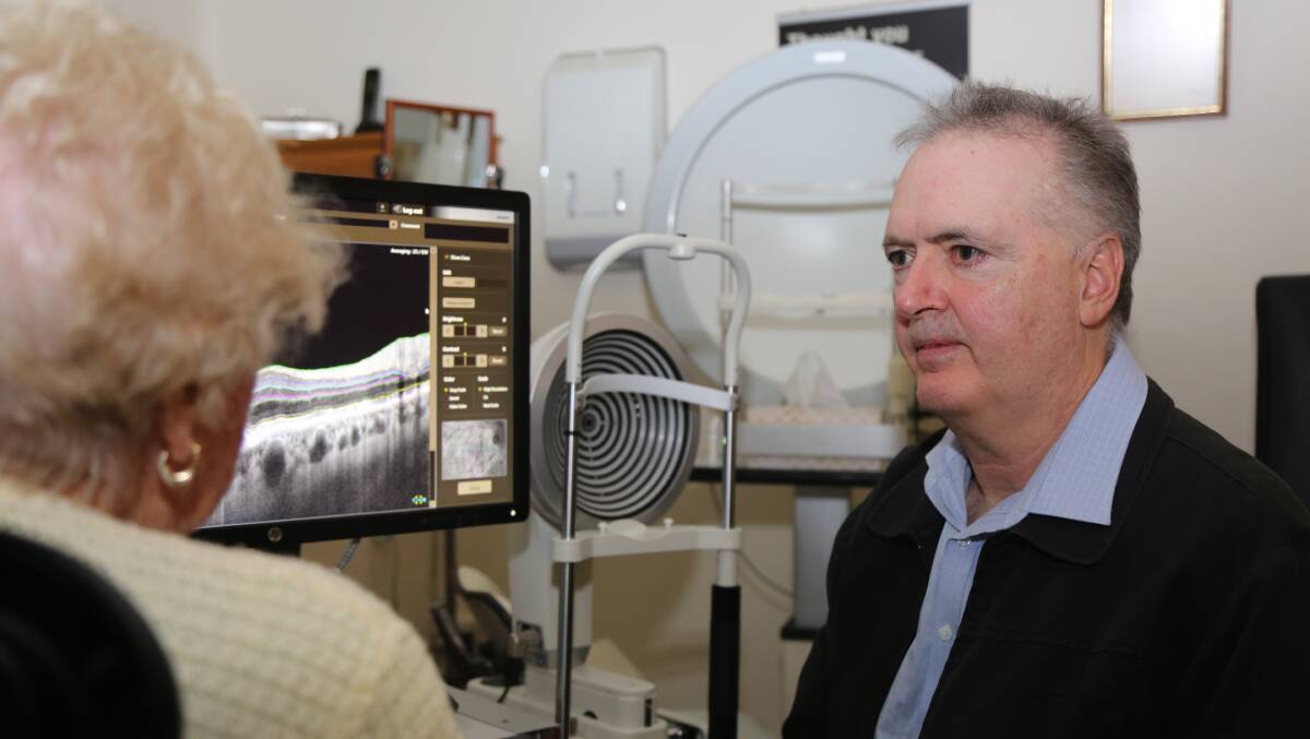 HEALTHY EYES: Optometrist Peter D'Arcy reviews a patient's eye health while at his clinic in Bega in 2018. Picture: Albert McKnight