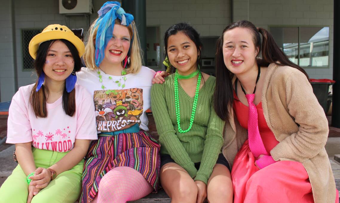FRIENDSHIPS: Sapphire Coast Anglican College Year 12 students Pink Phanphol, Emily Smith, Neera Sakunthai and Jacinta Tarlinton embrace the 1980s theme. Pictures: Albert McKnight 