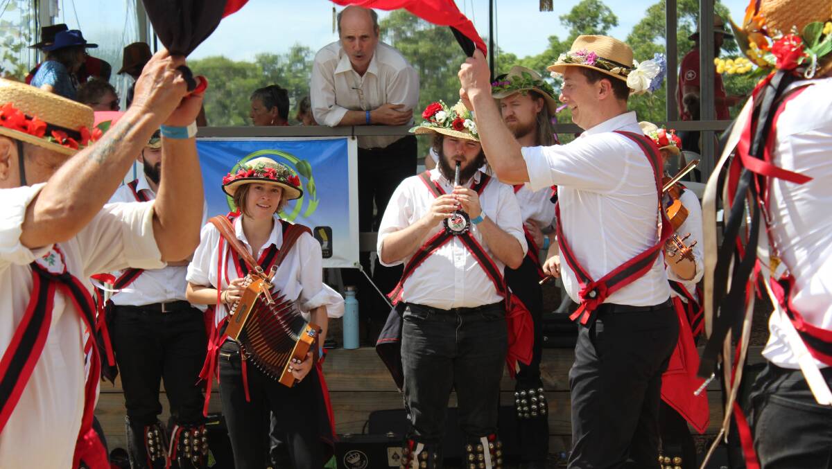 HAPPIER DAYS: Morris dancers perform at the 2019 Cobargo Folk Festival. 