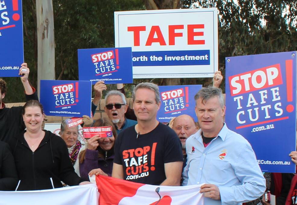 NSW Teachers Federation organiser Rob Long (third from right) at a protest outside Bega TAFE earlier this year. 