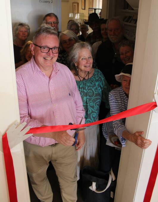 Don Harwin cuts the ribbon to symbolise the completion of the works at Spiral. 
