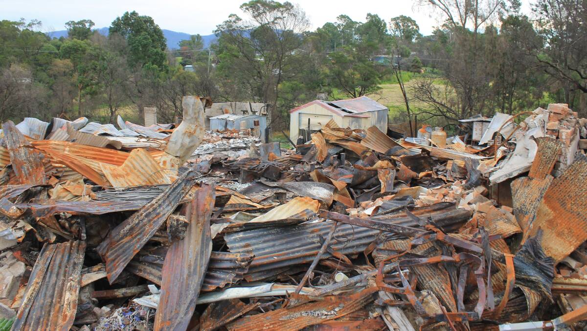 DEVASTATING: Cobargo's main street was devastated in the New Year's Eve bushfire, but clean-up works began this week.
