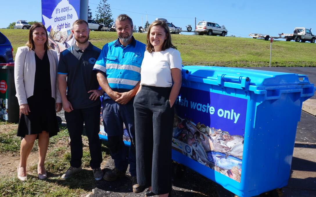 Standing next to one of the blue fish waste bins at Bermagui's harbour are Bega Valley Shire Mayor Kristy McBain, Ocean2earth founders Kyran and Tim Crane and council's acting waste services manager Joley Vidau. 