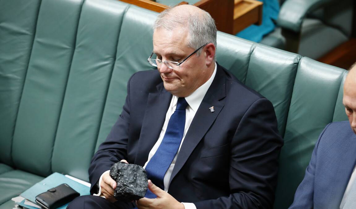 Treasurer Scott Morrison with a lump of coal during Question Time at Parliament House in Canberra on February 9, 2017. Photo: Alex Ellinghausen