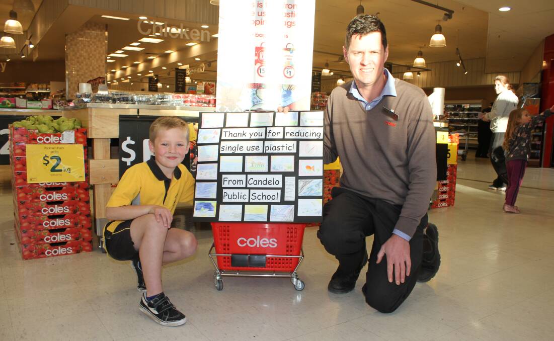 ENVIRONMENTALLY CONSCIOUS: Candelo Public School's Lucas Anderson thanks Bega Coles manager Tom Marshman for Coles banning plastic bags. 