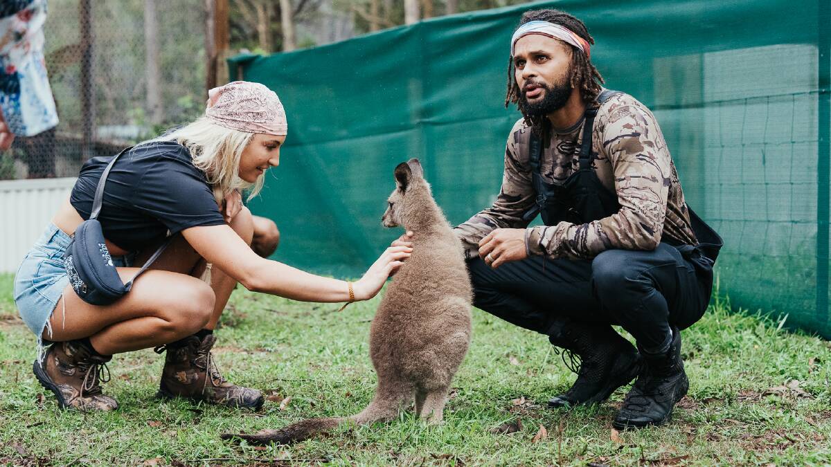 HERE TO HELP: NBA player Patty Mills and wife Alyssa help rebuild wildlife sanctuaries during a trip to bushfire-struck South Coast earlier in 2020. Picture: Luke Currie-Richardson