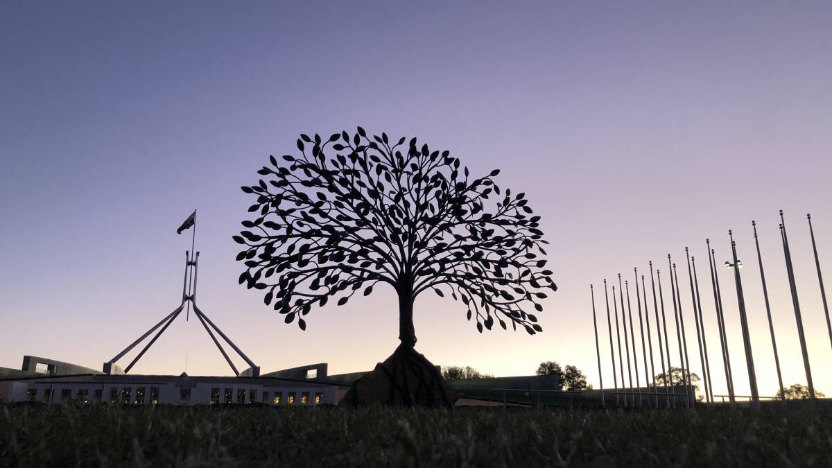 EMOTIONAL DAY: Richard Moffatt's 1.5tonne artwork, which has been named "The Healing Tree" by the public, stands in front of Parliament House.