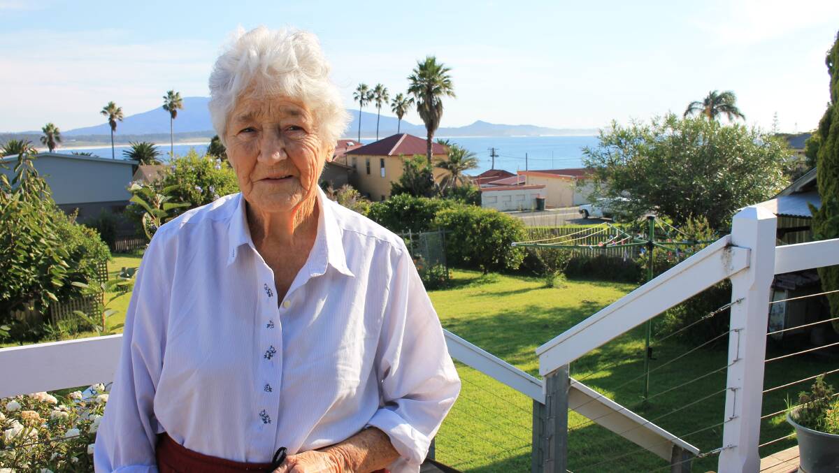 Gloria Sherwin shows the view from her veranda in early 2014, before Bermagui Woolworths was built.