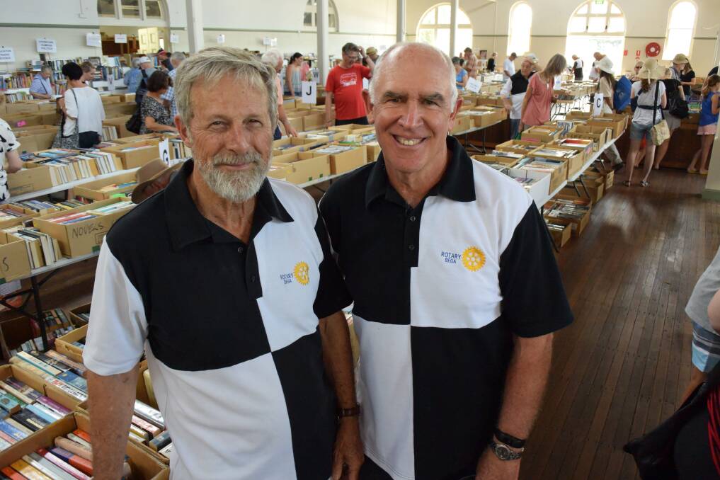 AVID READERS: Bega Rotary Club's Charlie Blomfield and Richard Galton at a book fair in 2017. 
