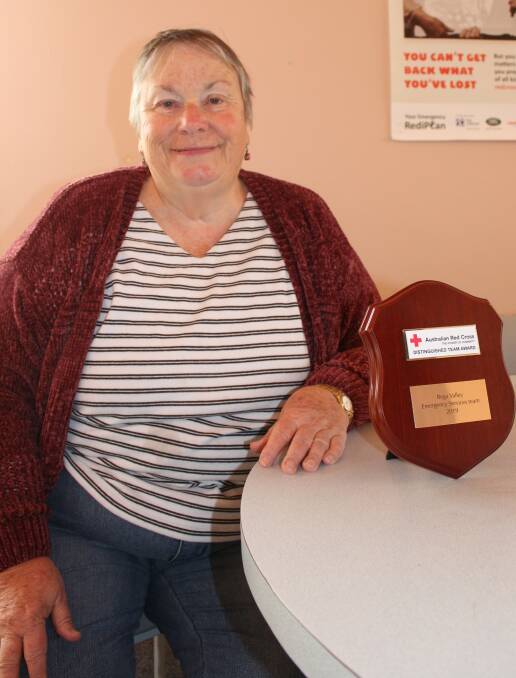 Red Cross Wolumla branch member and one of the leaders of the Bega Red Cross Emergency Team Pat Johnston with the award. 