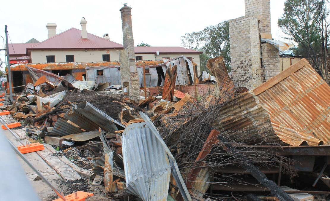 DEVASTATING: Cobargo's main street was devastated in the New Year's Eve bushfire, but clean-up works have now begun.