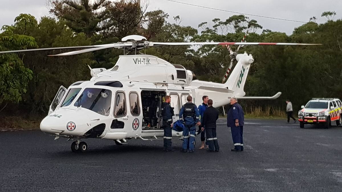 

The Toll NSW Ambulance Rescue Helicopter airlifted a Sydney man after he was washed off rocks at Currarong on Monday morning. Photo: Dave Cunningham TNV.