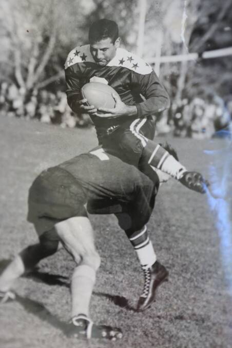 The stunning photo of Pyree Rovers player Greg Watts playing for Southern Districts tackling his American All Stars opposite number Ed Demirjian at Manuka Oval in Canberra on Wednesday, May 27, 1953.