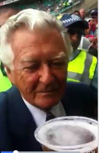  A screengrab from a YouTube video showing the former PM Bob Hawke being handed the beer by Mr Brandon.