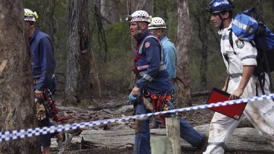 NSW Ambulance Specialty Casualty Access Team paramedic Jason Watson (centre) back in fresh air after his 11-hour rescue in the Bungonia cave system in 2014. Photo: Nick Moir