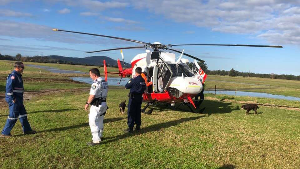 The NSW Rural Fire Service helicopter that was undertaking work in the flood emergency for the SES, landed on Pig Island. Image NSW Police Rescue & Bomb Disposal Facebook
