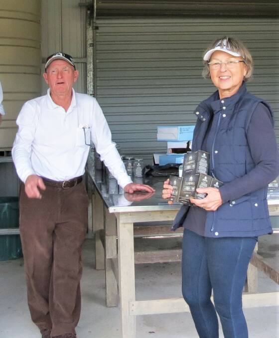 Christel Feldmann accepts her prizes after winning the C grade double barrel and single barrel rounds in the Bega Gun Club's June shoot where Chris Field was named High Gun. 