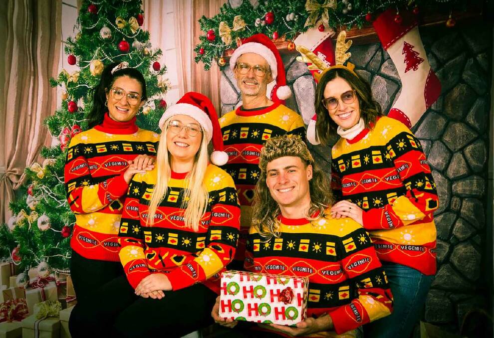 You can unleash your love of Vegemite in your very own limited ugly christmas sweater available online now, or visit Instagram for a chance to win one for you and two friends. Picture: supplied. 