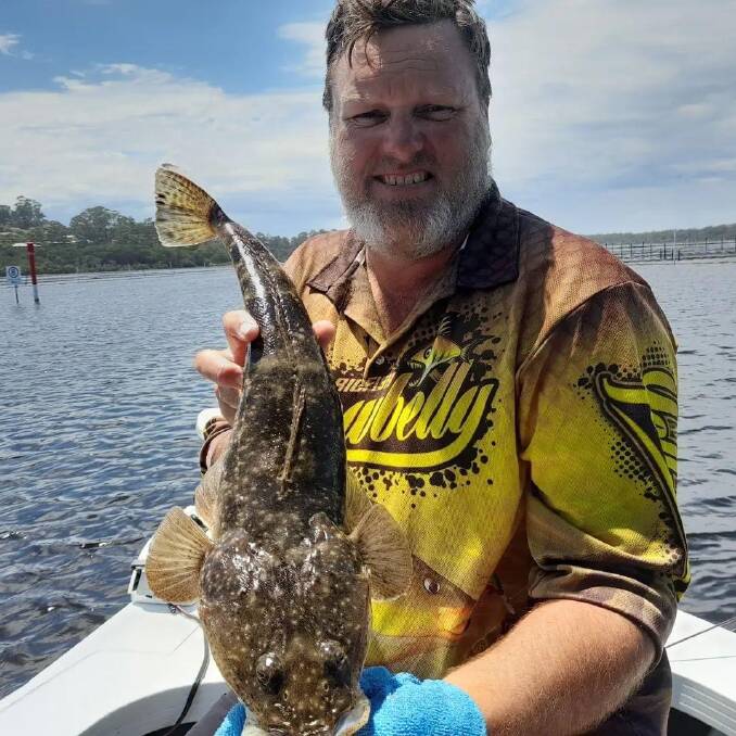 Goondiwindi, Queensland, visitor Bill Bell shows his magnificent catch and release dusky flathead taken in Merimbula Lake.