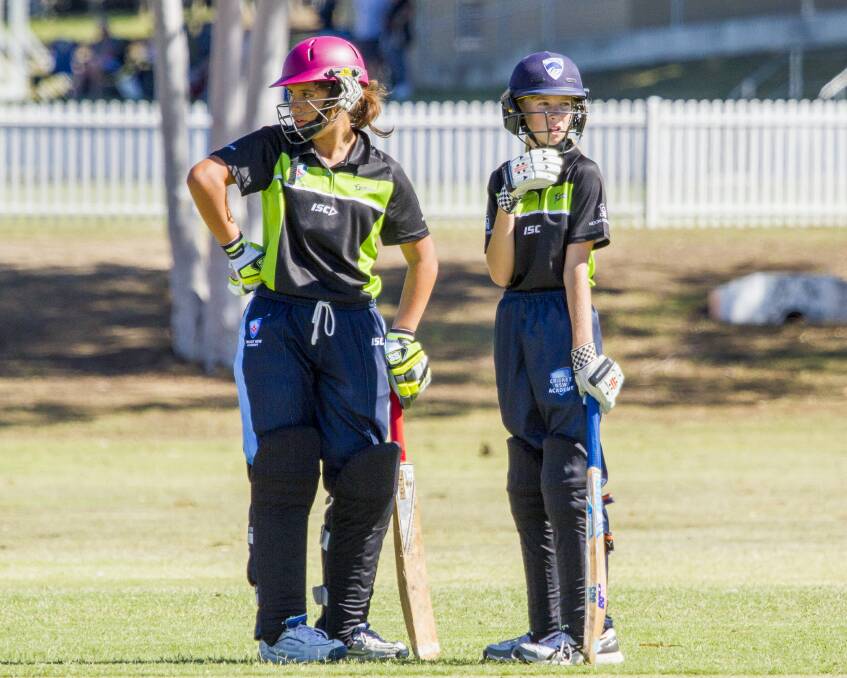 National contenders: Jessie Mudaliar and Jade Allen talk tactics during a 57-run partnership for Country Thunder. 