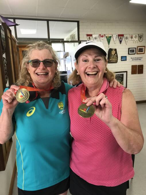 Sally Bowes and Denise Dion celebrate their gold medal finish in the ladies tennis doubles at the Masters Games in Adelaide. 