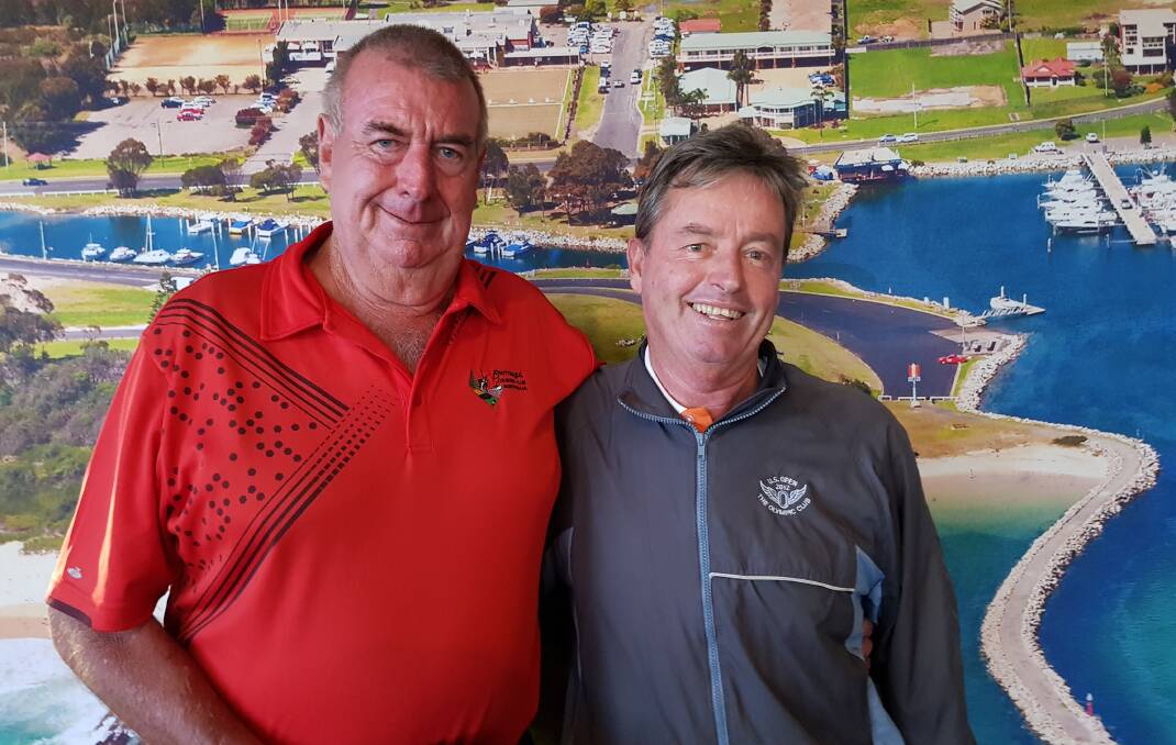 Bermagui monthly medal winner Max Luland is congratulated on his result by golf pro and sponsor Chris Hearn. 