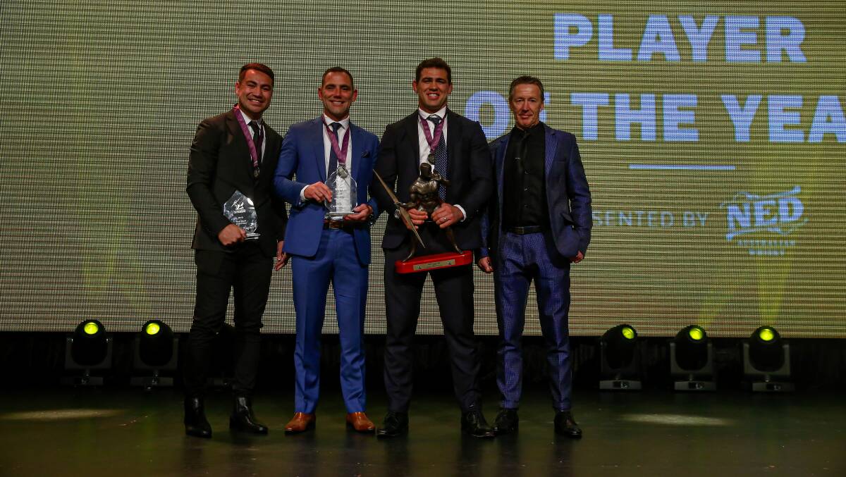 Top honours: Dale Finucane (second from right) is congratulated by coach Craig Bellamy and team-mates after being named the Storm Player of the Year. Picture: Melbourne Storm. 