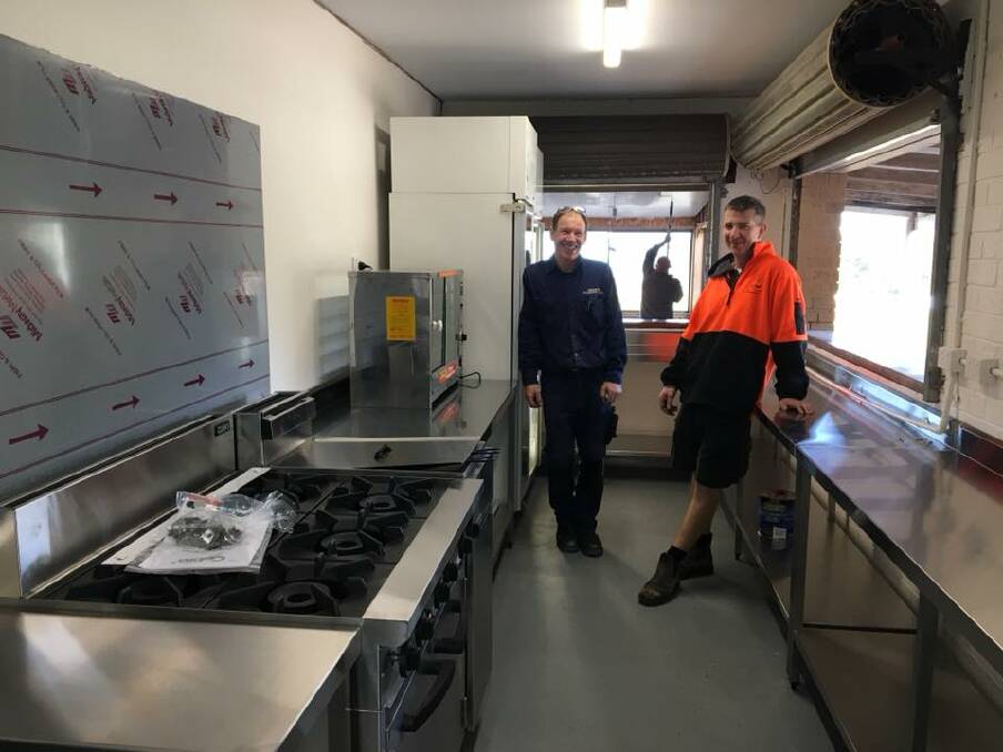 Metal shine: Danny and Gary show off the new stainless steel kitchen at Lawrence Park, just some of the huge upgrades to the facilities. Picture: Facebook. 