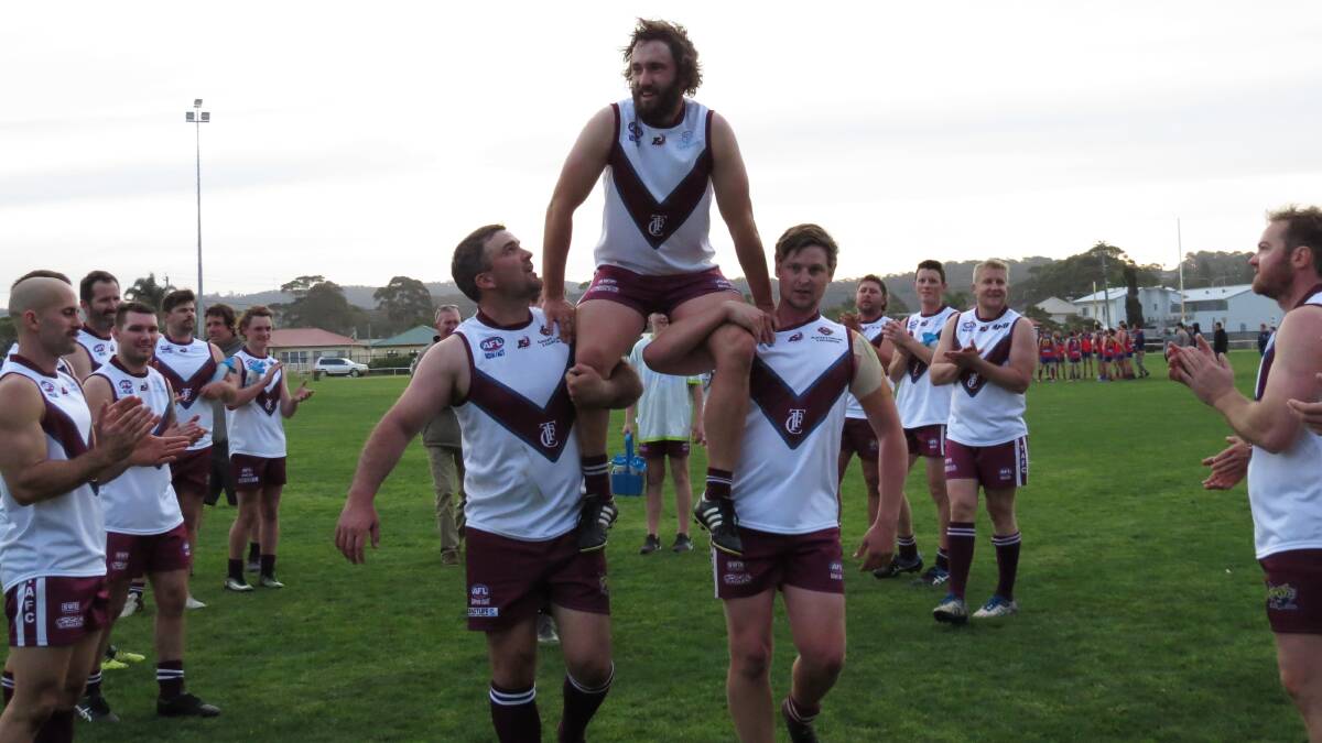 Milestone match: Tom Lipsham is carried from the field to celebrate his 100th senior game for the Tathra Sea Eagles. Picture: Shirley Rixon. 