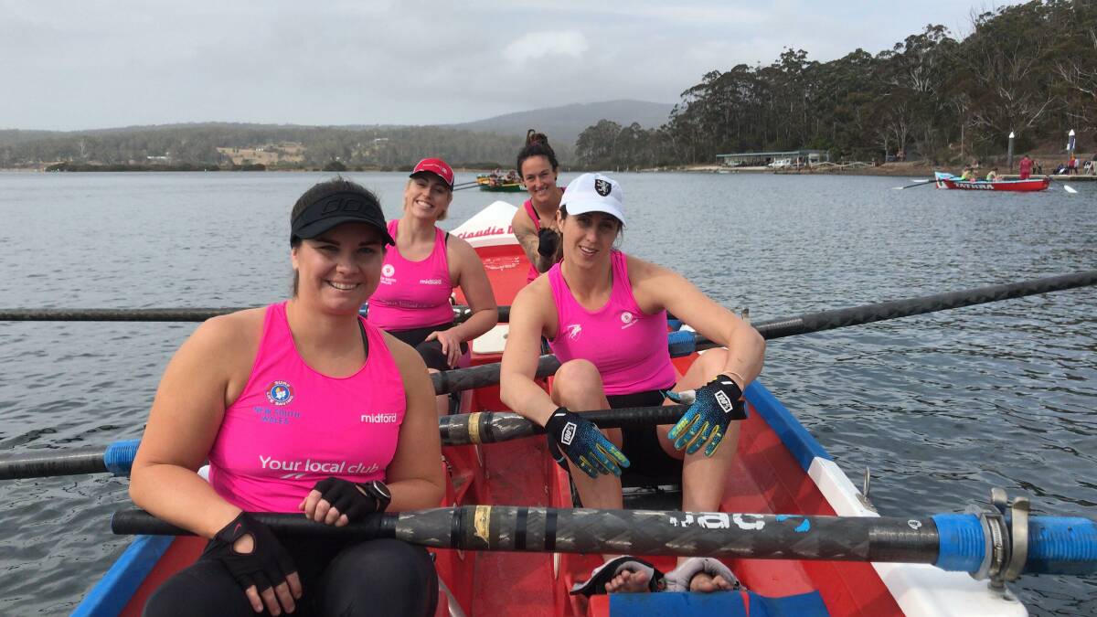 The women's division winning crew from Broulee celebrate at the finish of the Club to Pub in Pambula Lake last year. 