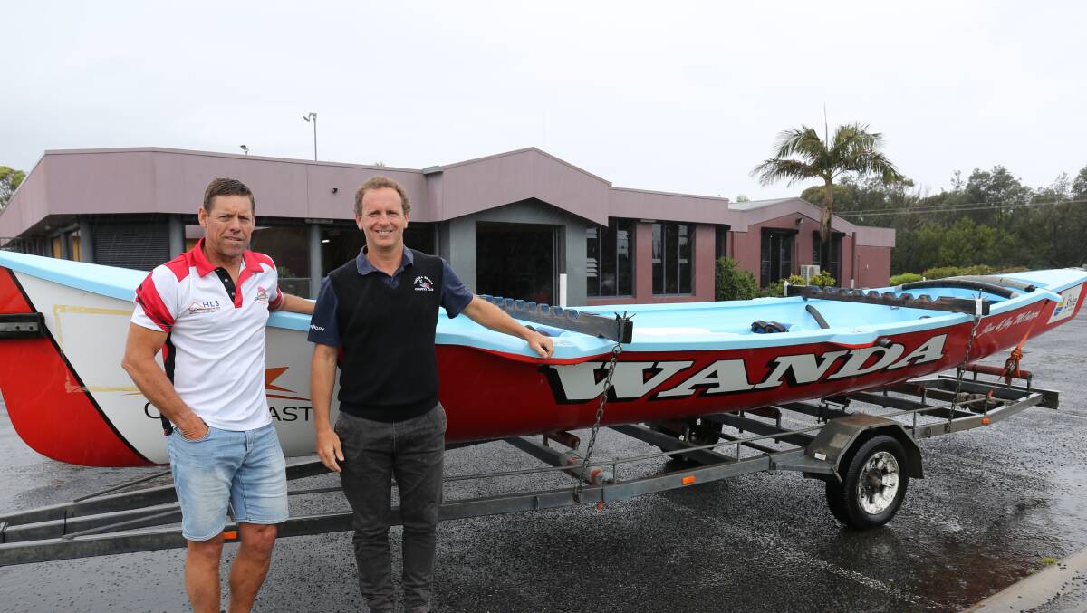 Fleet addition: Tathra surfboat captain Peter George and Tathra Beach Country Club manager Ben Potter with the new boat donated by the Wanda Surf Club. 