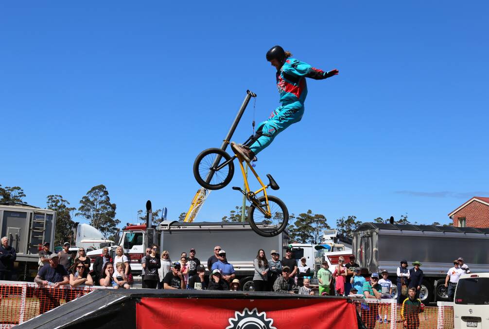 High-flying: Josh Williams goes hands free with a tombstone trick during a set of the Flair Action Sports riders at the Pambula Motorfest. 