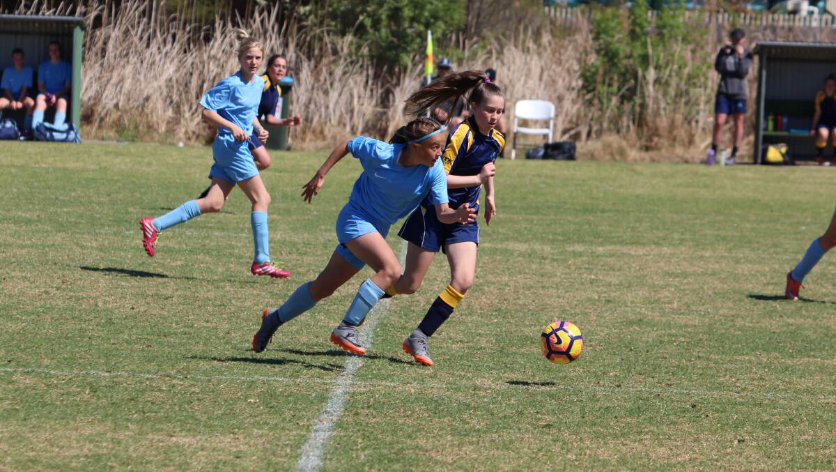 Speedy forward: Eliza-Jane Norris eyes up the goals against the Brindabella Blues during the Karl Posselt Cup in October. 