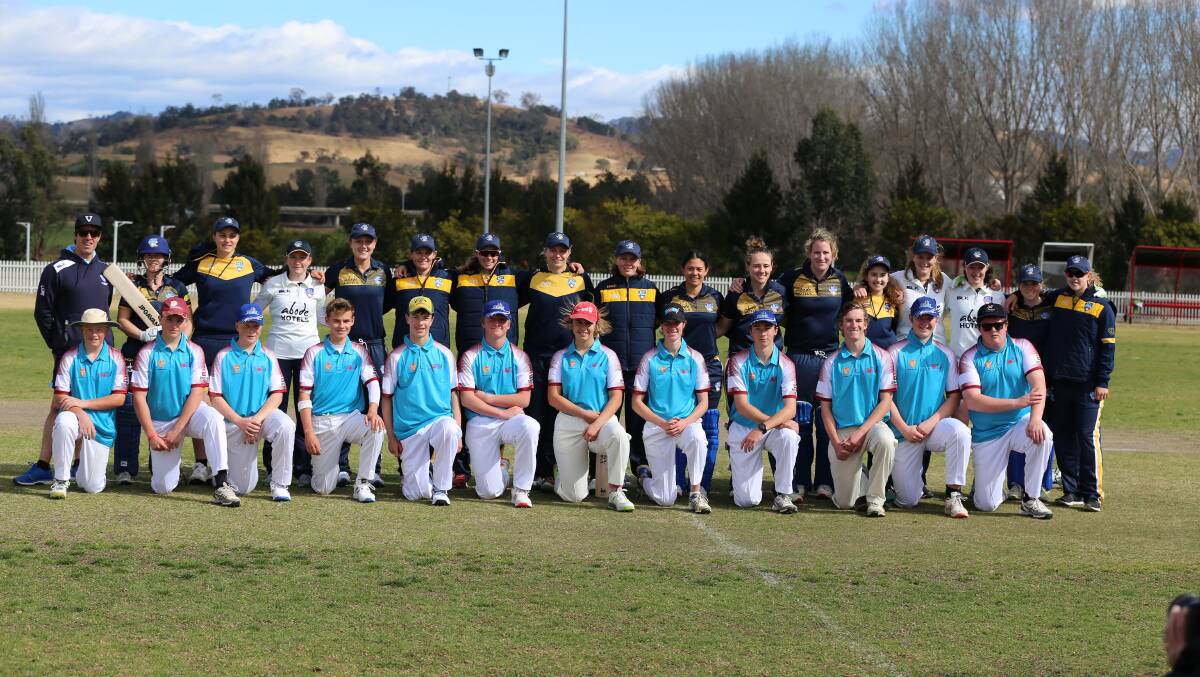 The ACT Meteors and FSC combine pause for a quick photo before their trial match at Bega's George Griffin Oval on Saturday. 
