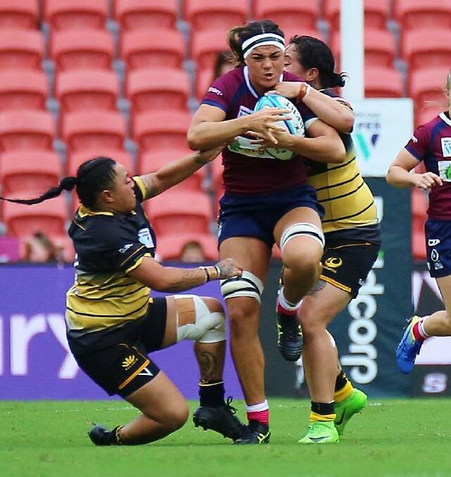 Strong runner: Cobargo's Millie Boyle makes a run for Queensland against WA at Suncorp Stadium. Picture: Craig Dick /Facebook