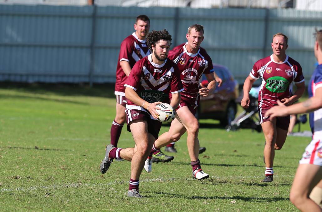 Callum Bower-Scott runs the ball up with support from his team-mates in a recent outing for the Tathra Sea Eagles. 
