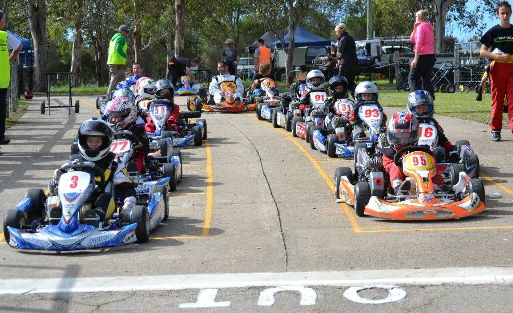Lined up: Karters line up on the starting grid before a race at the Sapphire Coast Kart Club's April competition recently. More racing will go ahead on Sunday. 
