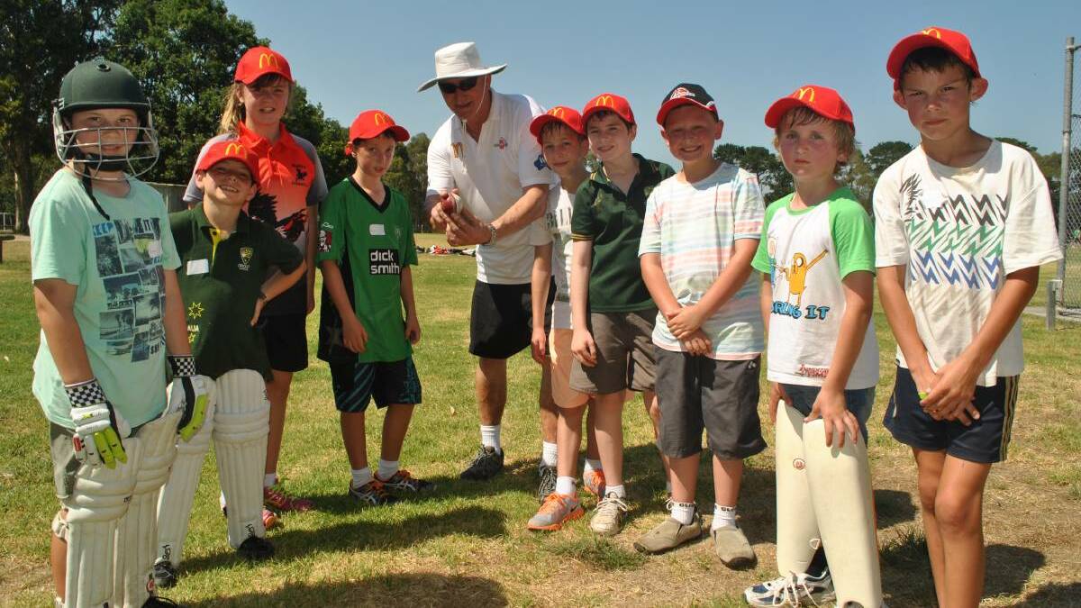 Giving rise for kids: Former Australian fast-bowler Len Pascoe with a group of kids at a coaching session in Victoria. 