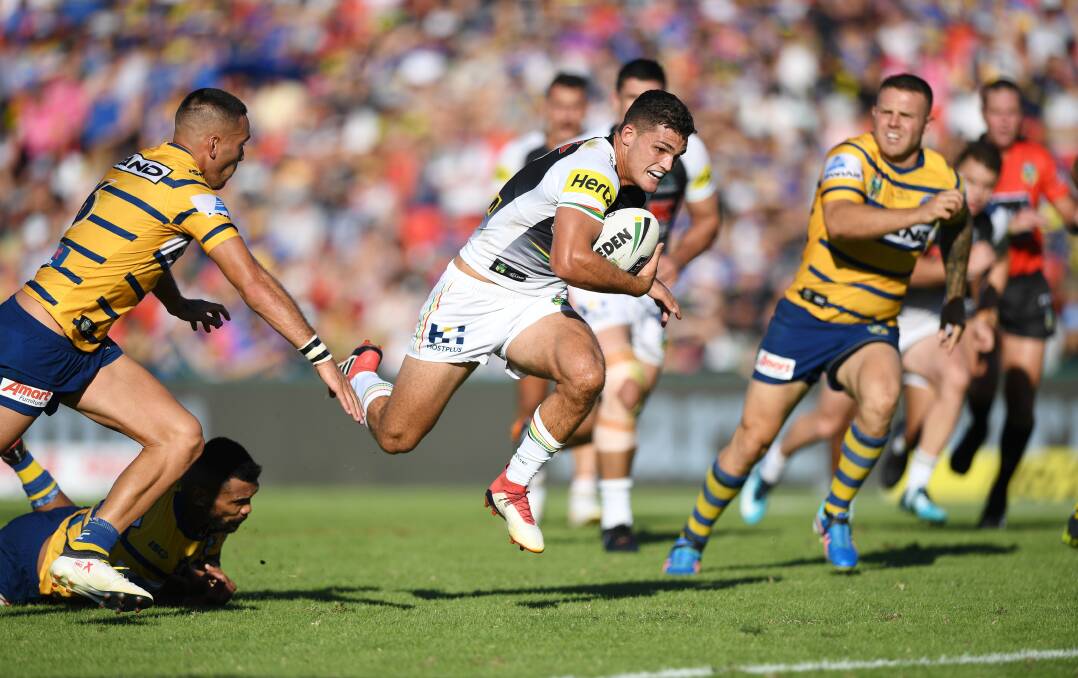 A hop and a skip: Nathan Cleary skips a tackle attempt in the Panthers' last clash with the Eels with the two clubs to contest a Battle of Bega on Feb 29. Picture: NRL. 