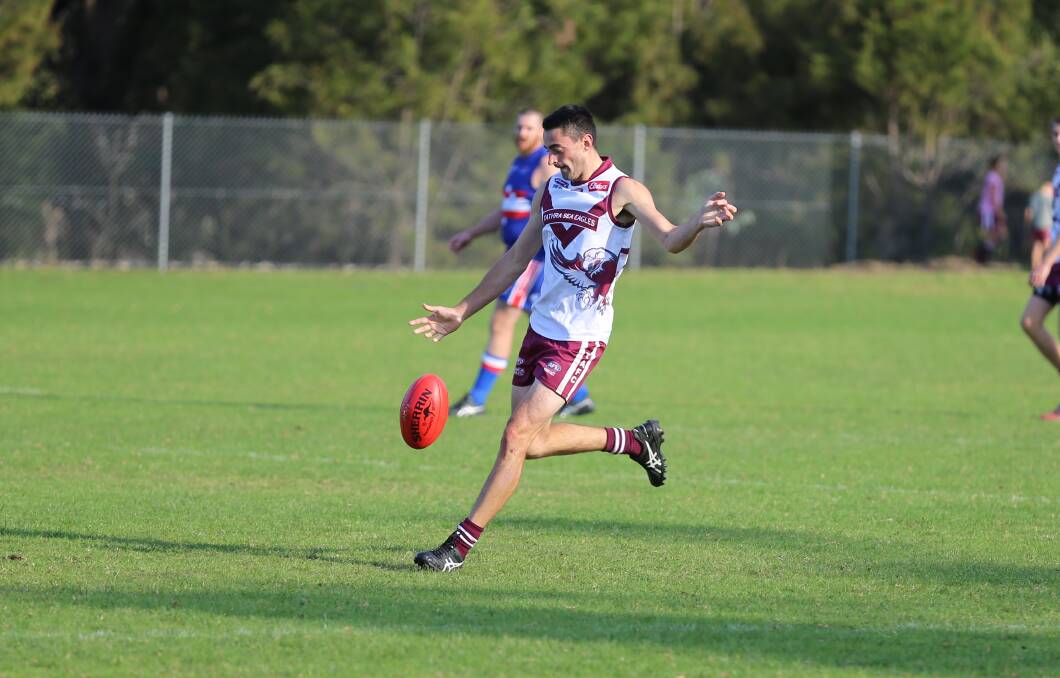 Working the middle: Louis Coulton kicks forward during Tathra's loss to the Merimbula Diggers on Saturday. 